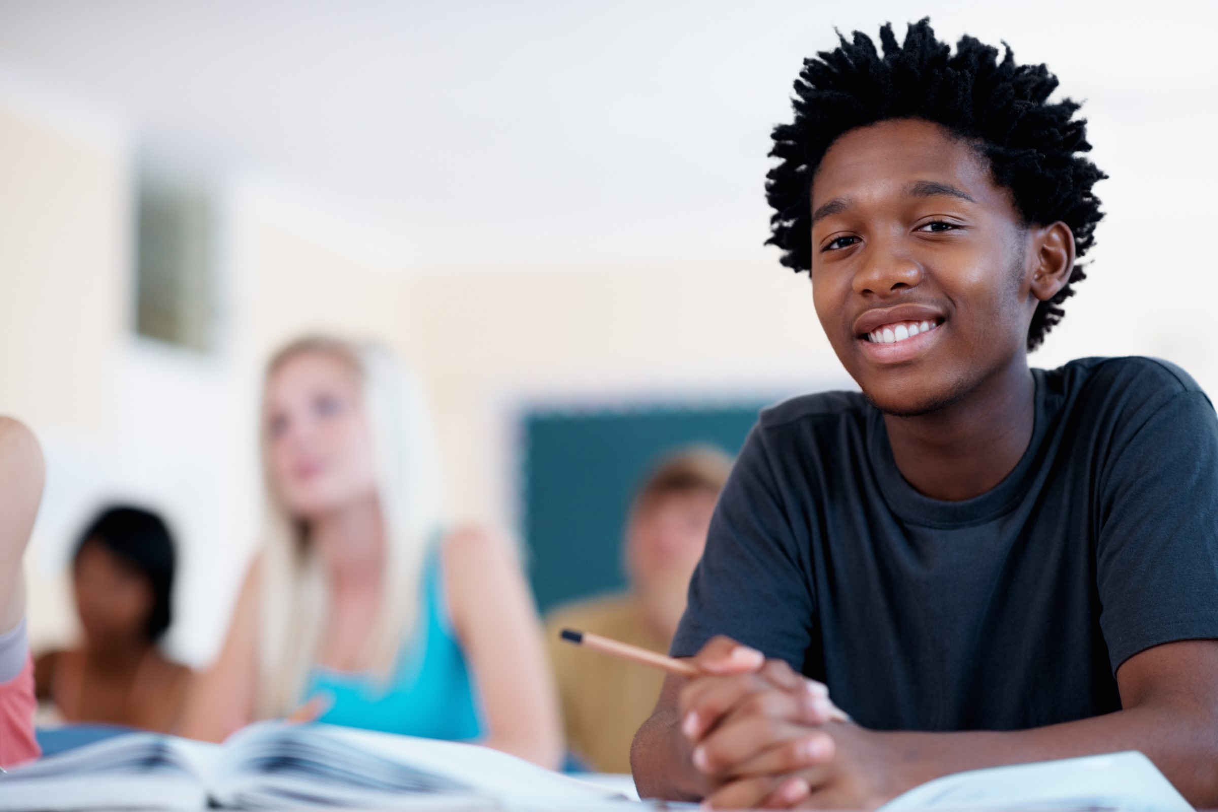 A student sitting at a desk in class